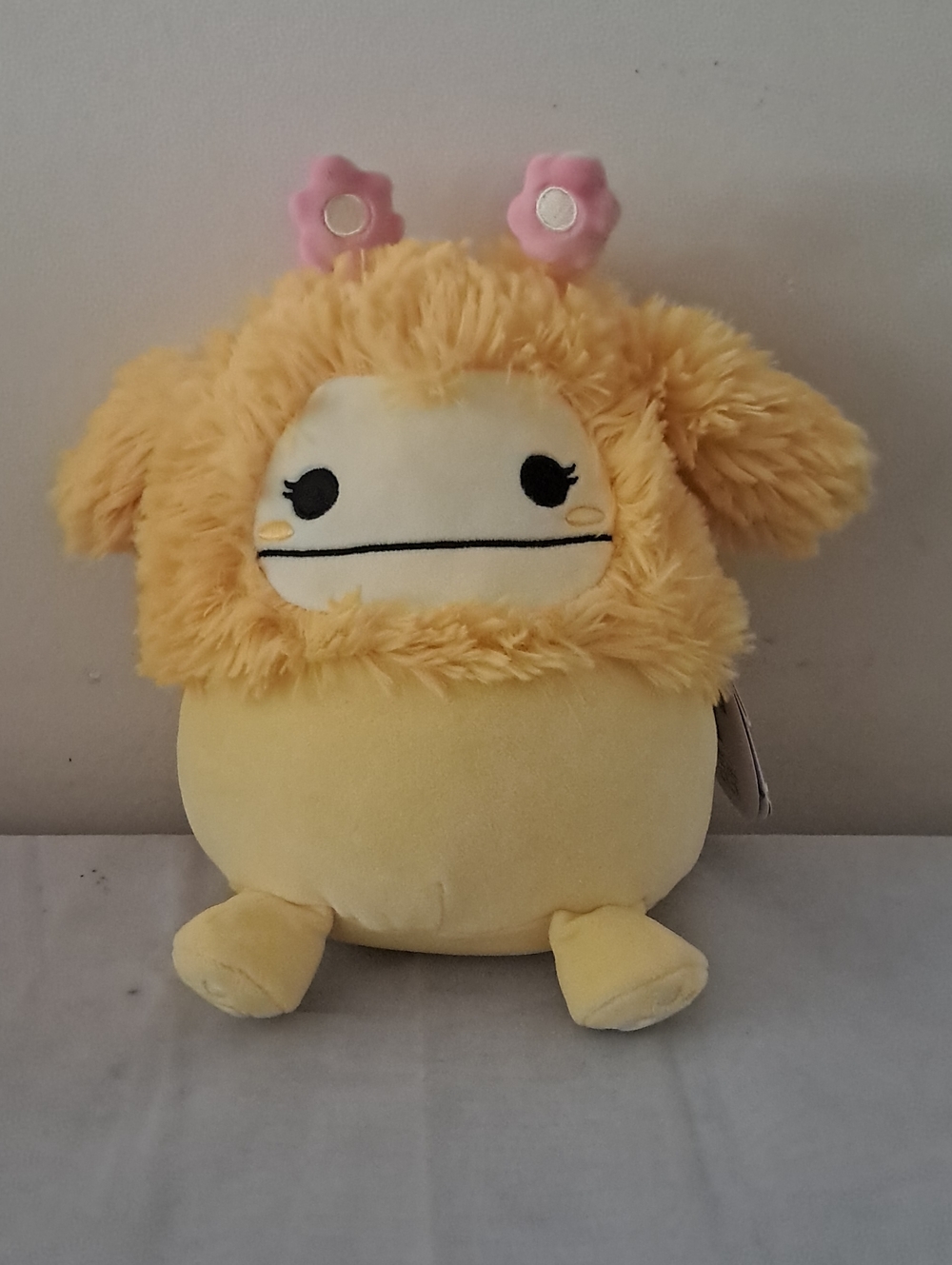 Squishmallow Nomi Plush Character with Pink Flower Antennae